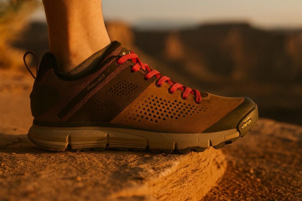 Close‑up of Danner Trail 2650 shoe on dry White Rim sandstone ledge.