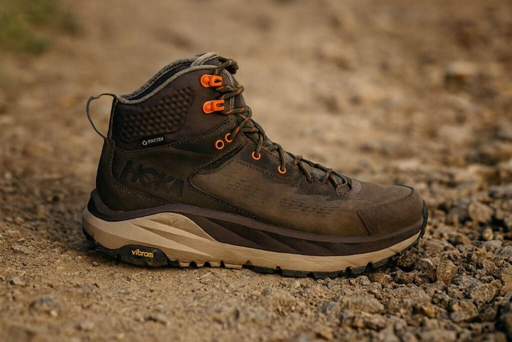 Close-up of HOKA Sky Kaha GTX hiking boots on gravel-packed dirt trail.