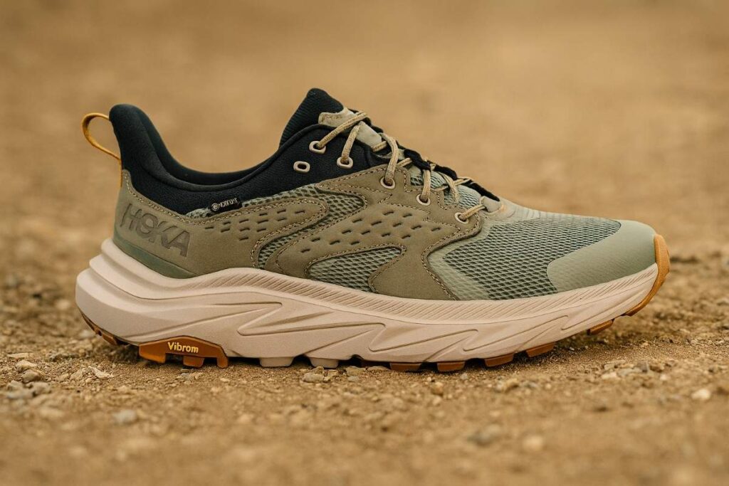 Hoka Anacapa 2 Low GTX lightweight hiking shoes on a dirt trail with pebbles.