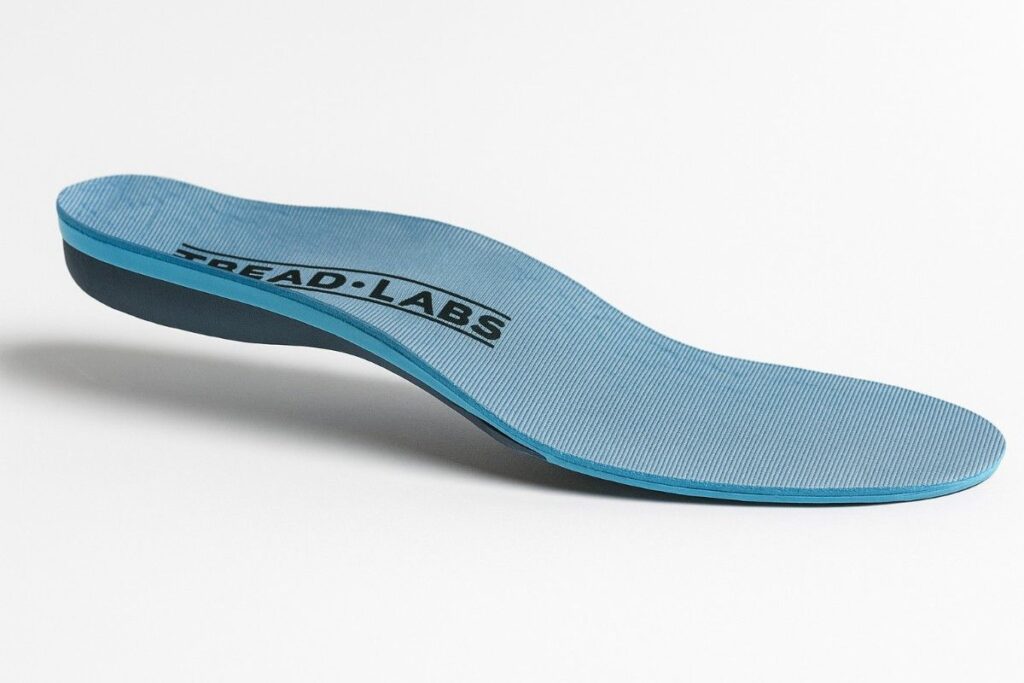 Powerstep Pinnacle Maxx insole for plantar fasciitis with firm arch support and deep heel cup.