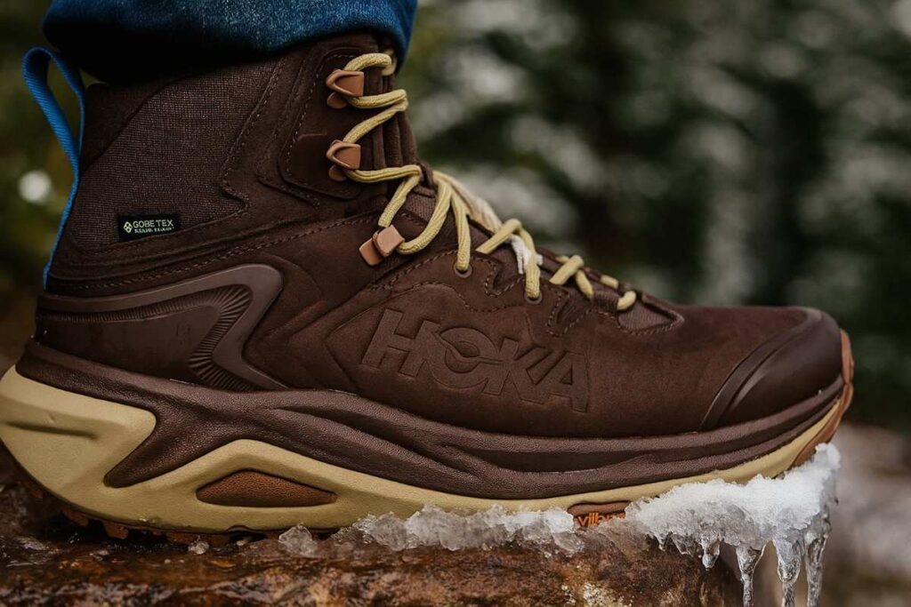 Close up of Hoka Kaha 3 GTX displayed on ice surface.