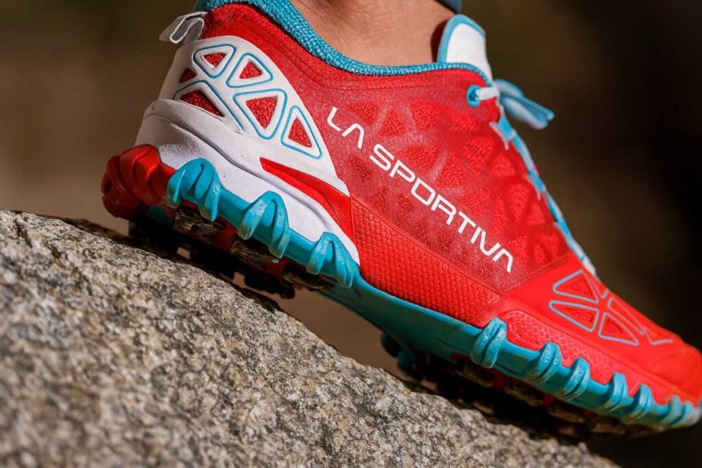 Close-up of La Sportiva Bushido II women’s trail running shoes gripping rocky terrain.