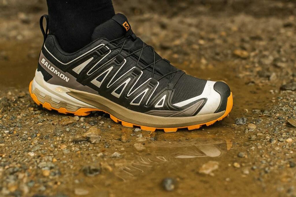 Salomon XA Pro 3D v9 GTX waterproof trail shoes on wet rocky and muddy path close-up.