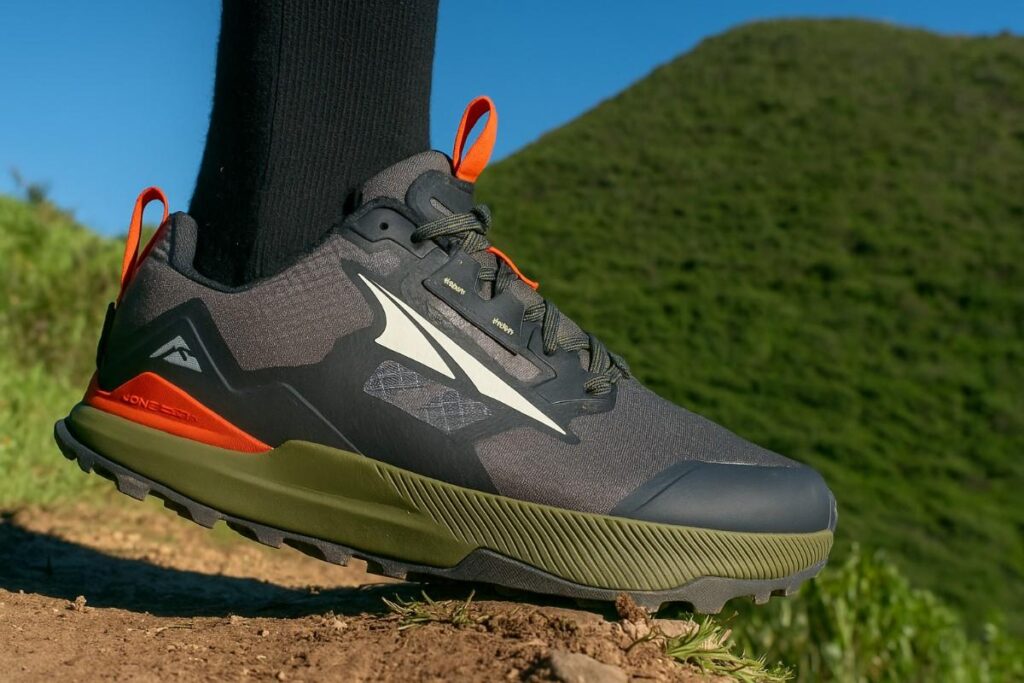 Close-up of hiker's legs wearing Altra Lone Peak 7 on a mount trail.