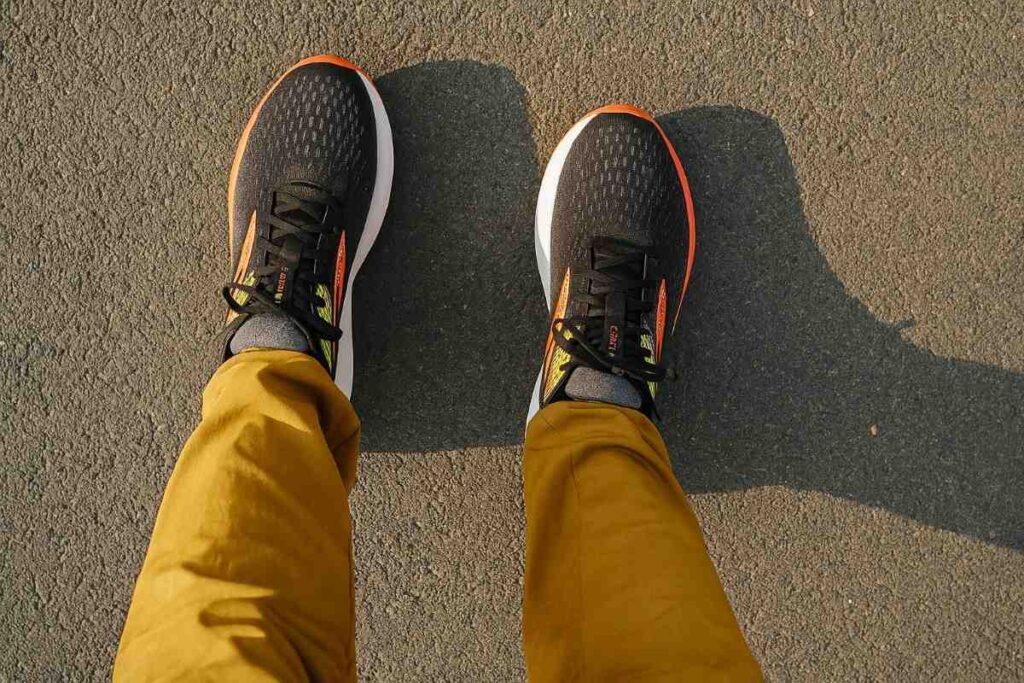 Above-angle view of Brooks Ghost 16 on a road trail.