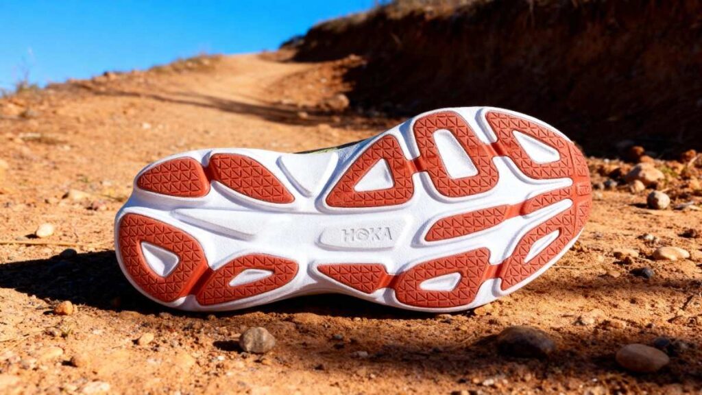 Outsole of HOKA Bondi 8 displayed on a dry trail.