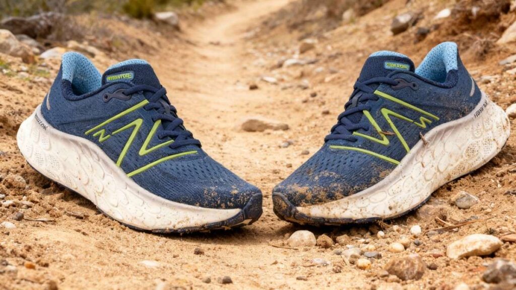 Pair of New Balance Fresh Foam X More v4 placed on a dirt trail. 