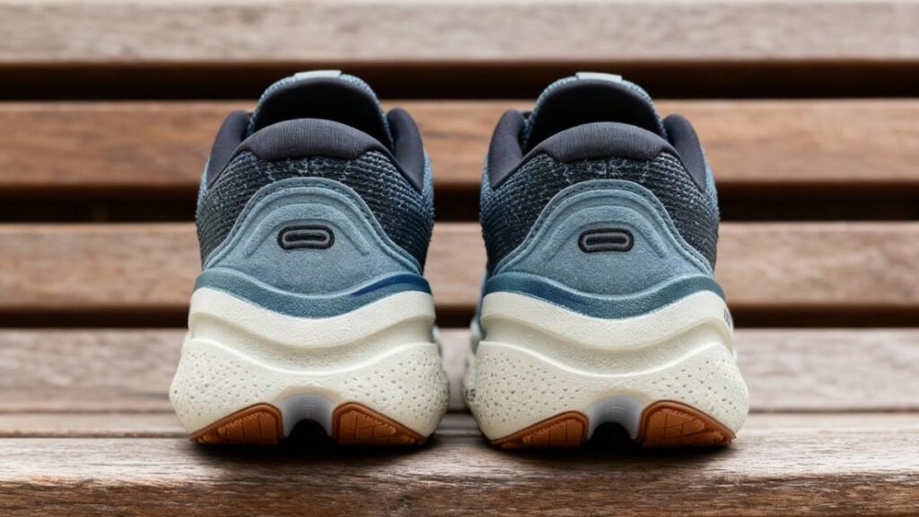 Heels view of Brooks Ghost Max 2 placed on a wooden bench.