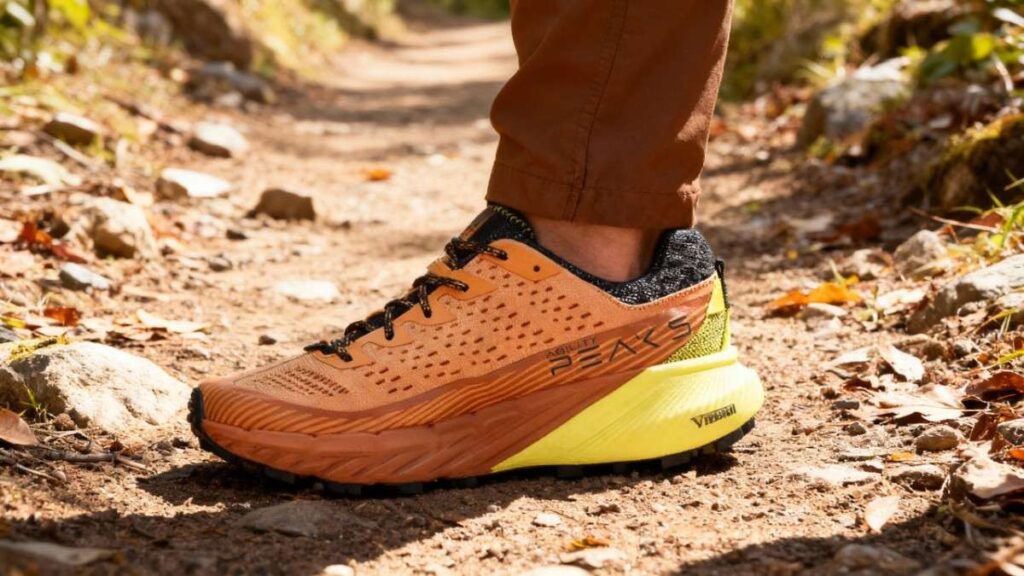Close-up shot of hiker's leg wearing Merrell Agility Peak 5.