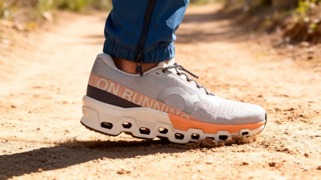 Close-up of hiker's legs wearing On Cloudmonster 2 .