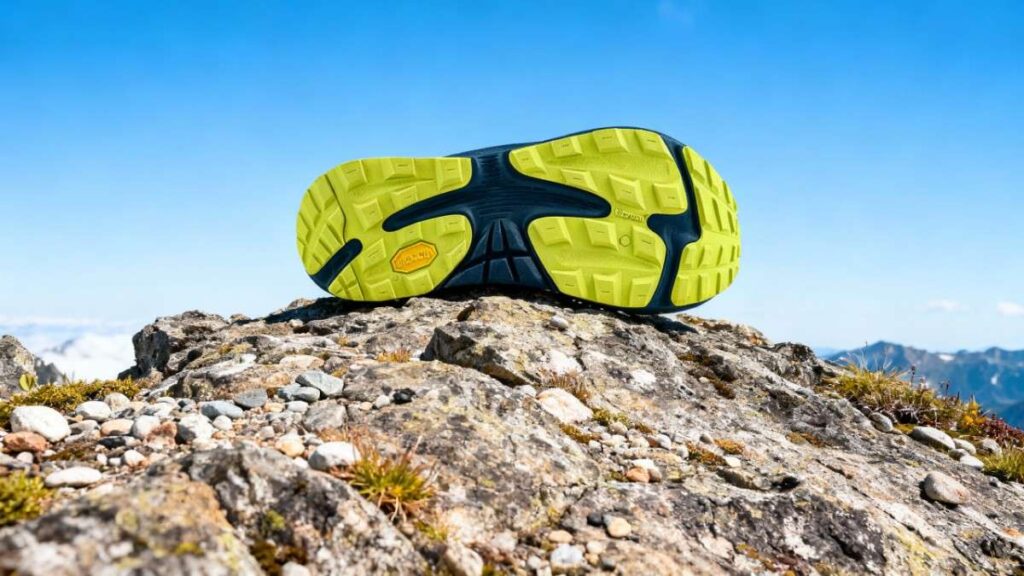 Outsole of Topo Ultraventure 3 placed on moun rocks.