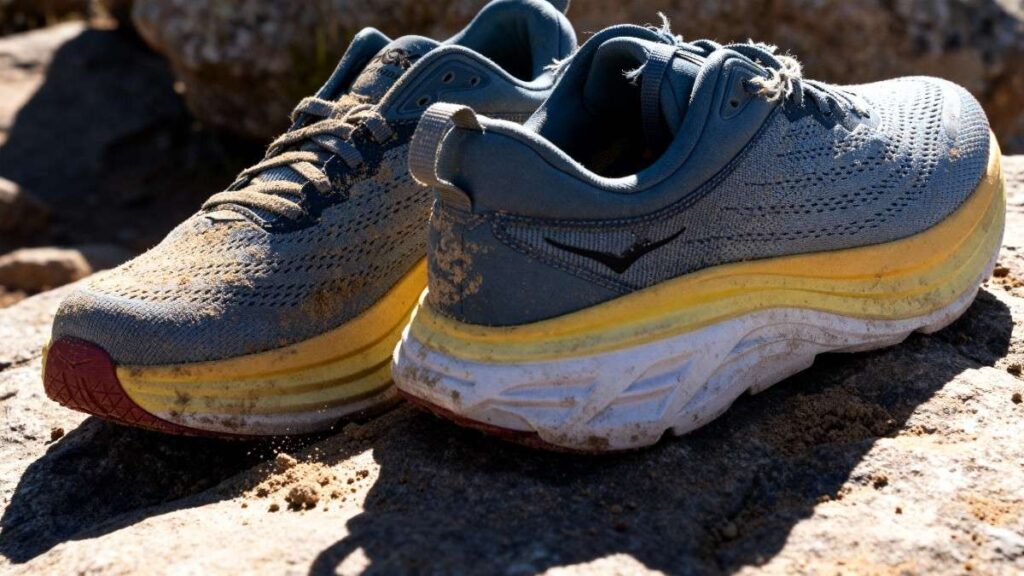 Pair of Hoka Bondi 8 placed on a rocky surface. 