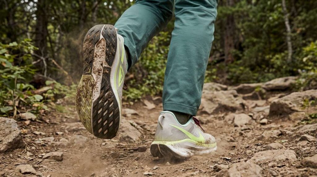 Rare view of hiker walking while wearing Nike Pegasus Trail 5 GTX. 