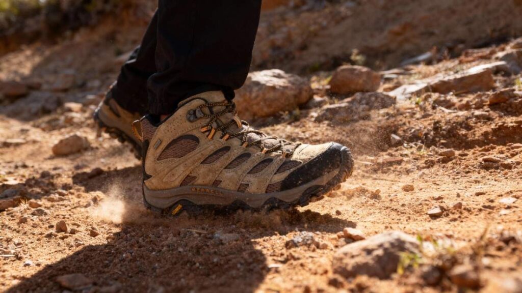 low angle view of hiker wearing Merrell Moab 3 Mid Waterproof.