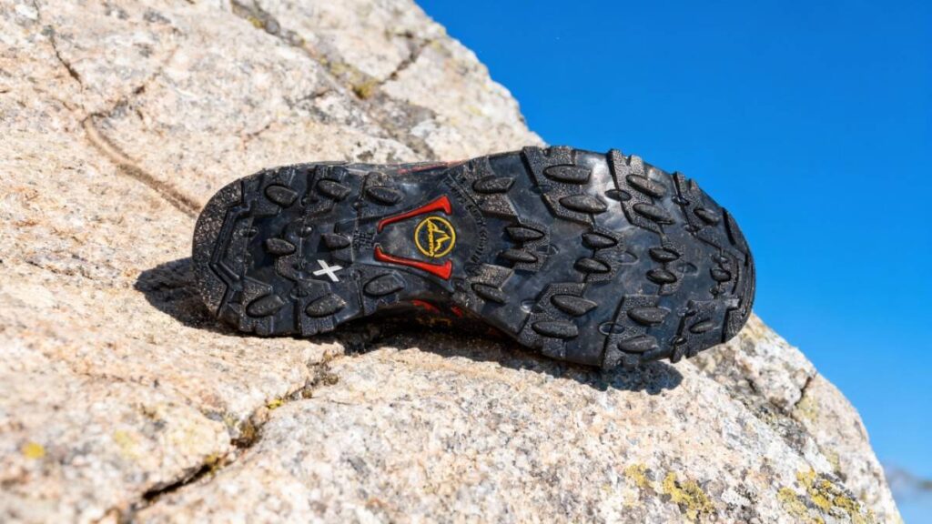 Outsole of La Sportiva Ultra Raptor II Mid GTX placed on a rock.