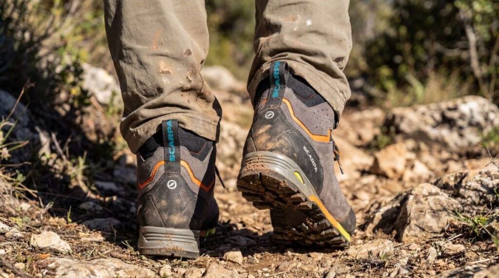 Heels view of Scarpa Zodiac Plus GTX in hiker's legs.