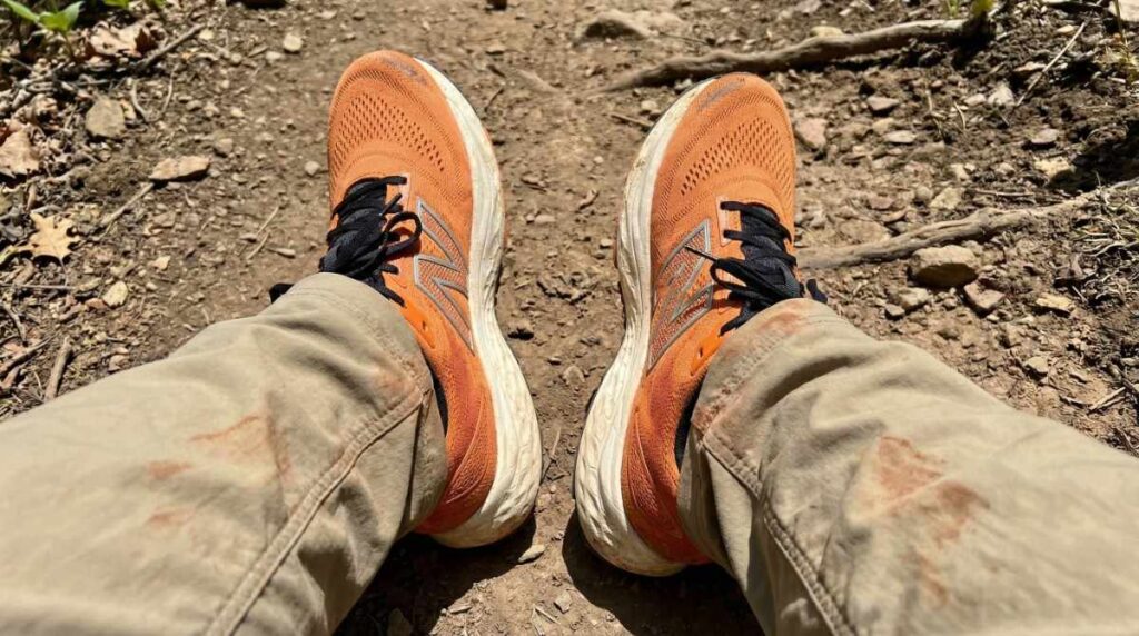 Above angle selfie shot of hiker's legs wearing New Balance Fresh Foam X 880 v14.