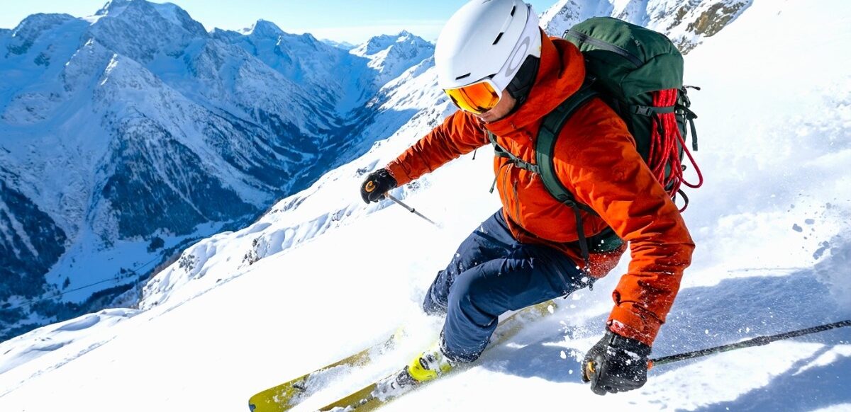 Alpine-Ski-Action Action shot of hiker skiing on snow mount.